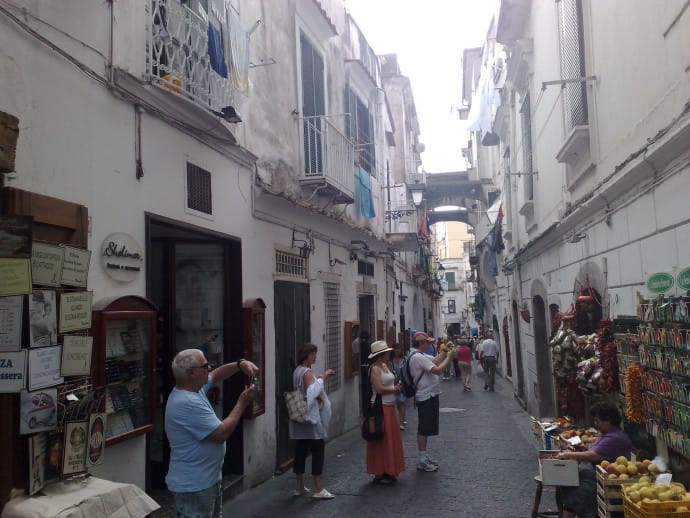 The tourists swarm in the narrow streets of Amalfi